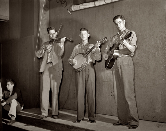 Photo showing: Nathan, Jasper and Weldon: 1942 -- The Drake family at a Saturday night dance for the Farm Security Administration's resettlement camp at Weslaco, Texas.