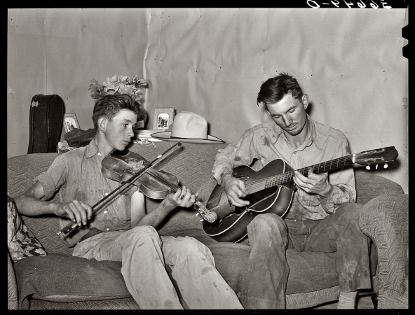 Photo showing: Band of Brothers -- June 1940. Pie Town, New Mexico. Farmer and his brother making music.