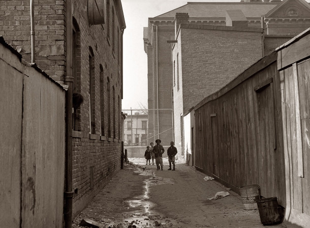 Photo showing: Alley Kids -- Washington, D.C., November 1935. Alley near L Street NW with Blake School in background.
