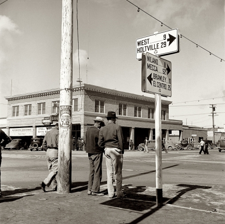 Photo showing: Calipatria Corners -- Idle pea pickers discuss prospects for work in California's Imperial Valley, February 1939.