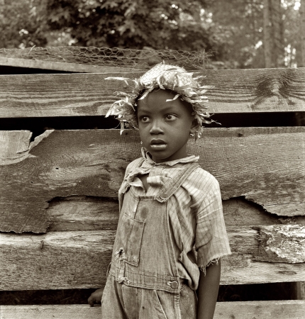 Photo showing: Granville County Boy -- North Carolina July 1939. Grandson of tenant farmer whose father is in the penitentiary.