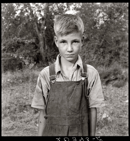 Photo showing: Valley Boy -- Yakima Valley, Washington, August 1939. Migratory boy in squatter camp, come for the third year to pick hops.