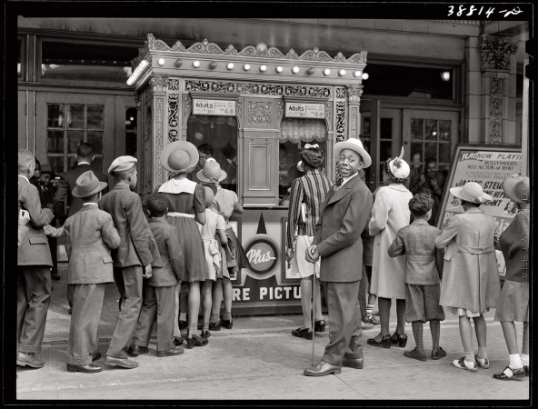 Photo showing: Movie Line: 1941 -- Chicago moviegoers waiting to see The Philadelphia Story starring Stewart, Grant and Hepburn.