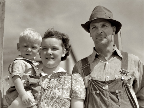 Photo showing: Looking Ahead -- August 1941. Laredo, Montana. Farm Security Administration borrower and 2 of his children.