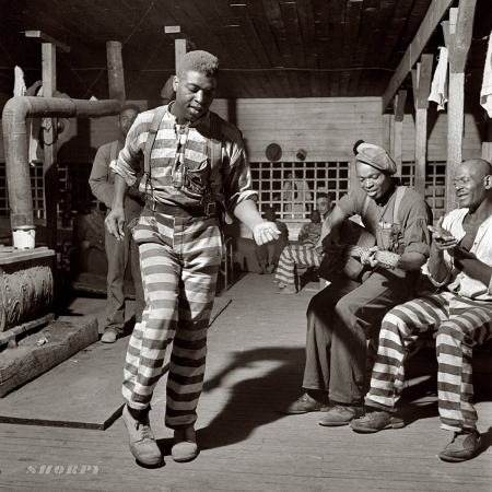 Photo showing: Jailhouse Rock -- May 1941. Convict camp in Greene County, Georgia. The guitarist is bluesman Buddy Moss.