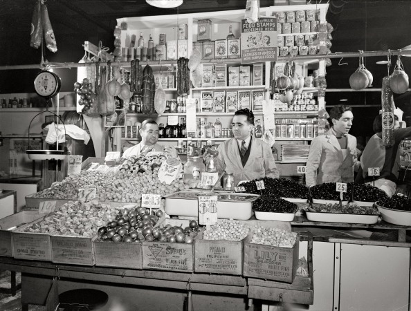 Photo showing: First Avenue Market -- January 1943. New York. Italian grocer in the First Avenue market at Tenth Street.