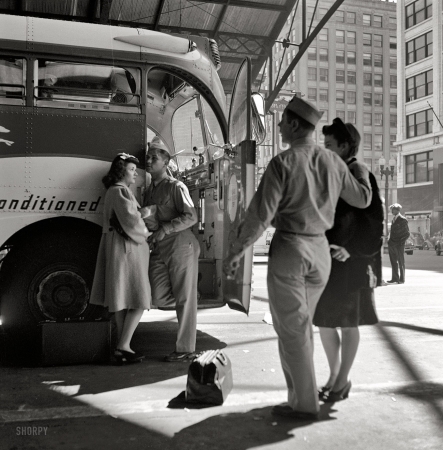 Photo showing: Greyhound Goodbye -- September 1943. Soldiers with their girls at the Indianapolis bus station. 
