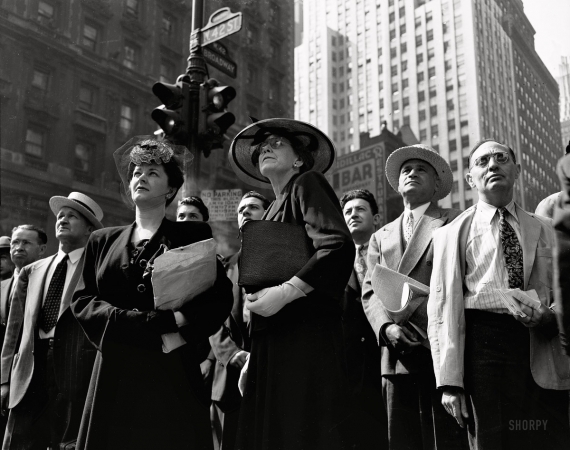 Photo showing: Watching the News: 1944 -- New York. June 6, 1944. D-Day. Crowd watching the news line on the Times building at Times Square.