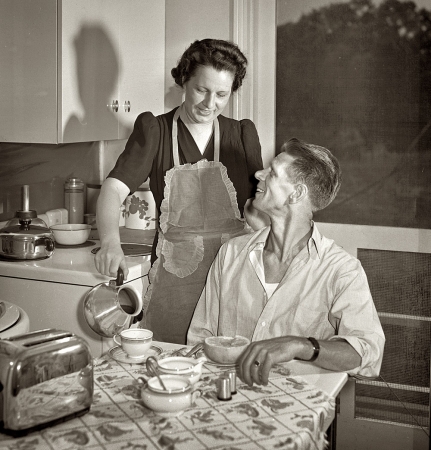 Photo showing: Another Cup? -- June 1942. Sheffield, Alabama. Preparing breakfast for her husband before he leaves for work at the aluminum plant.