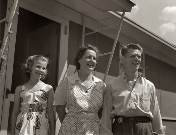 Photo showing: A Brighter Tomorrow -- Sheffield, Alabama, June 1942. Kenneth C. Hall with his wife, Helen Louise, and daughter Peggy.