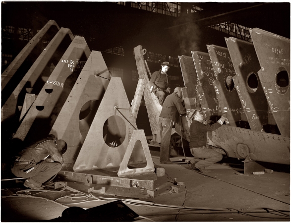 Photo showing: Building Liberty Ships -- In an abandoned freight car factory near the Atlantic coast, 1941.