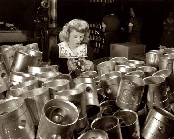 Photo showing: Perusing Pistons -- Final check on pistons destined for use by America's armed forces. Aluminum Industries Inc., Cincinnati, 1942.