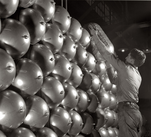Photo showing: Conversion for War -- War conversion of beverage containers, Firestone factory at Akron, Ohio, February 1942.