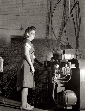 Photo showing: She Makes Sparks Fly -- August 1942. Republic Drill and Tool Company, Chicago.