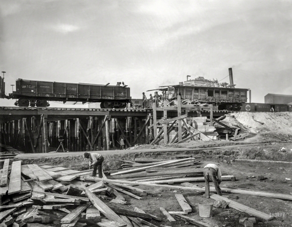Photo showing: Working on the Railroad. -- October 1, 1901. Track elevation and stone mixer, Chicago.