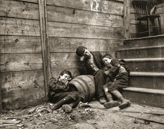 Photo showing: Street Arabs -- New York circa 1888. Street Arabs in 'sleeping quarters'.