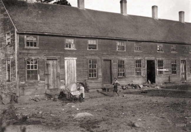 Photo showing: Where the Bogs Are -- September 1911. Crowded tenement used by cranberry pickers in bogs near Wareham, Massachusetts.