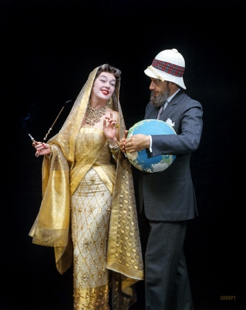 Photo showing: Auntie Mame -- September 1958. Rosalind Russell in costume from the film
Auntie Mame posed with author Patrick Dennis (E.E. Tanner III).