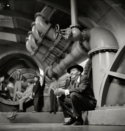 Photo showing: Guys and Dolls: 1955 -- July 1955. Frank Sinatra's gambling-in-the-sewer scene from the film Guys and Dolls.
