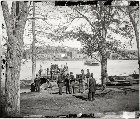 Photo showing: Potomac Passage -- Washington, D.C., circa 1861. Guards at ferry landing on Mason's Island examining a pass.