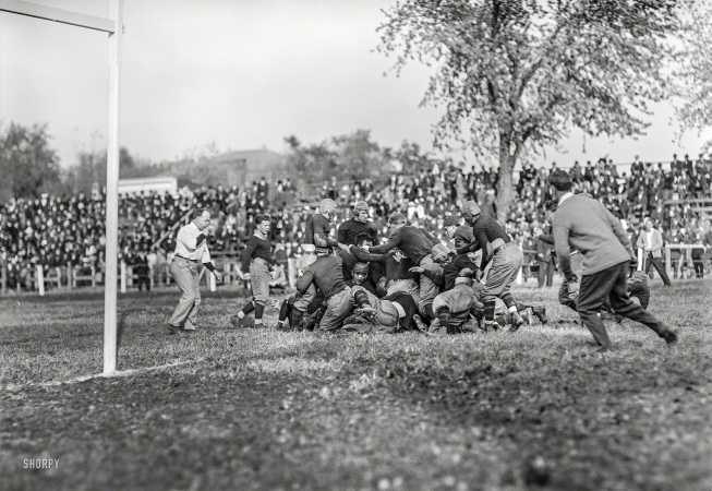 Photo showing: Piling On -- Washington, D.C., 1912. Football -- Georgetown-Carlisle game; Glenn Warner.