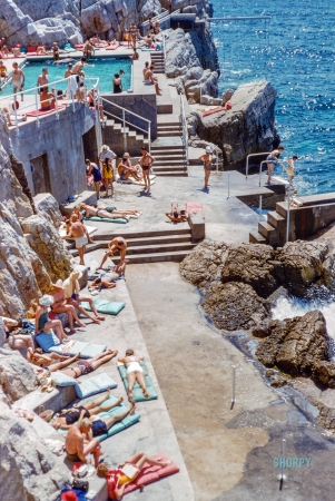 Photo showing: Cote d Azur -- August 1954. Antibes, French Riviera. Sunbathers at the Eden Roc, Côte d'Azur.
