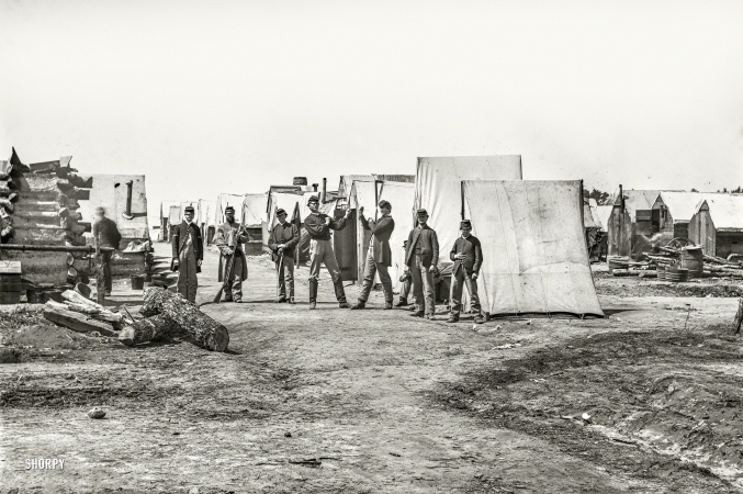 Photo showing: A Tent Situation -- April 1865. Petersburg, Virginia. Federal Army camp. Soldiers boxing.