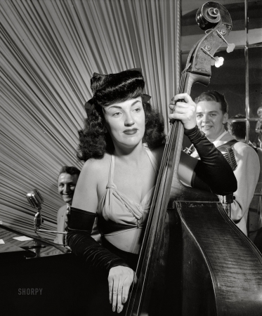 Photo showing: Jazz Lass -- New York, May 1947. Teddy Kaye, Vivien Garry and Arvin Arv Garrison at Dixon's.