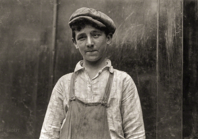 Photo showing: Larry the Doffer -- June 1916. Fall River, Mass. Lawrence Burns, 14, doffer in Pocasset mill. 43 Langley Street. Eye defect.
