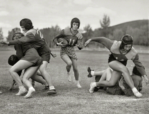 Photo showing: Powder Play -- Oct. 14, 1939. Captain Alice Shanks, carrying football, in Powder Bowl at Gunnison, Colorado. 