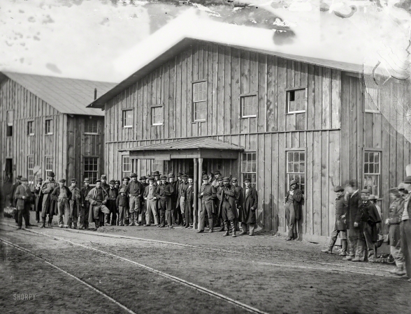 Photo showing: Landing Party. -- February 1863. Aquia Creek Landing, Virginia. Personnel in front of Quartermaster's Office.