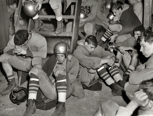 Photo showing: Locker Room Gloom -- Nov. 25, 1950. Dejected high school football team at Freeport Municipal Stadium after the first half.