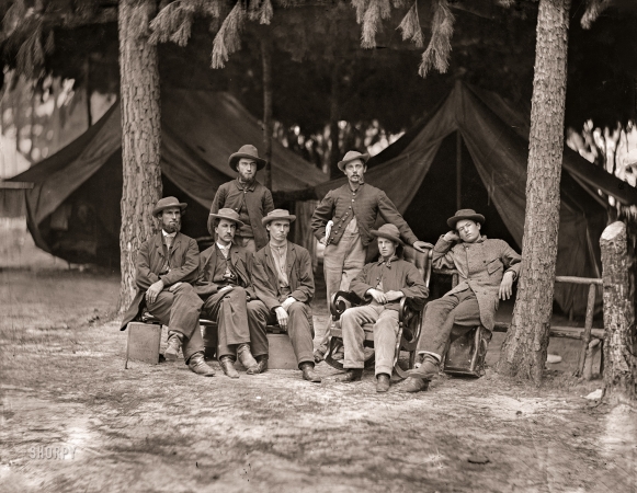 Photo showing: The Help Desk -- August 1864. Petersburg, Virginia. Military telegraph operators at headquarters. 