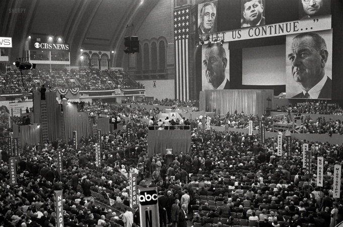 Photo showing: Let Us Continue -- Aug. 24, 1964. Atlantic City, N.J. View of delegates and stage with large pictures of John F. Kennedy, Harry Truman,
Franklin D. Roosevelt and Lyndon B. Johnson with the slogan 'Let Us Continue,' at the 1964 Democratic National Convention.