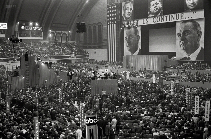 Photo showing: Let Us Continue -- Aug. 24, 1964. Atlantic City, N.J. View of delegates and stage with large pictures of John F. Kennedy, Harry Truman,
Franklin D. Roosevelt and Lyndon B. Johnson with the slogan 'Let Us Continue,' at the 1964 Democratic National Convention.