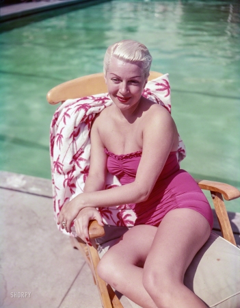 Photo showing: In the Pink -- 1951. Santa Barbara, California. Lana Turner lounging by the pool at the Coral Casino.