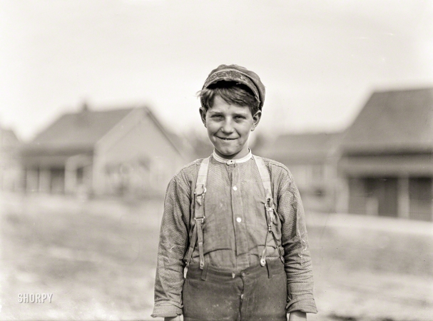 Photo showing: Young Rush -- November 1908. Gastonia, N.C. Rush Merrill, Loray Mill. 12 years
old. Been in mill three years as Doffer. Gets 75 cents a day.