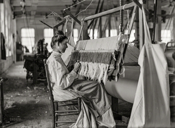 Photo showing: Cherryville Warper -- November 1908. Woman at beam warper. Melville Mfg. Company, Cherryville, North Carolina.