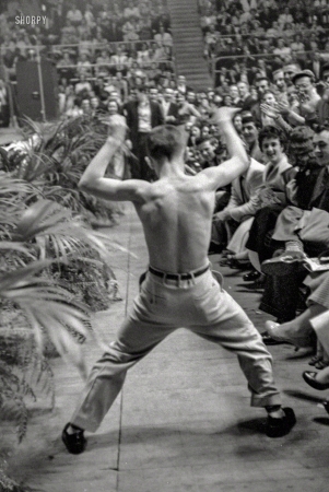 Photo showing: Rock Around the Clock -- April 1956. Shirtless teenaged boy dancing in the audience at a performance by
Bill Haley and the Comets and LaVern Baker at the Sports Arena, Hershey, Pennsylvania. 