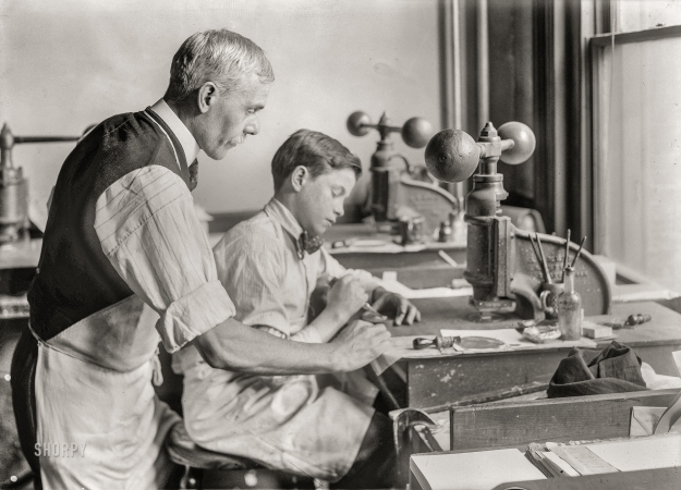 Photo showing: The Apprentice. -- Jan. 30, 1917. 14-year old Fred cutting dies for a new job.
Embossing shop of Harry C. Taylor. 61 Court Street, Boston.