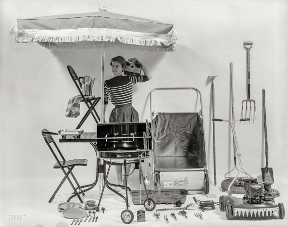 Photo showing: Outdoor Living -- 1954. Backyard Rooms. Woman posed with yard equipment, outdoor furniture, appliances, etc.