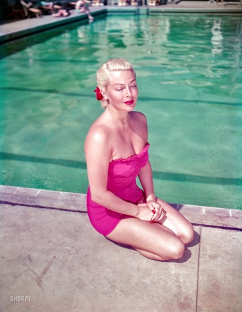 Photo showing: Golden Girl -- 1951. Santa Barbara, California. Lana Turner lounging by the pool at the Coral Casino.