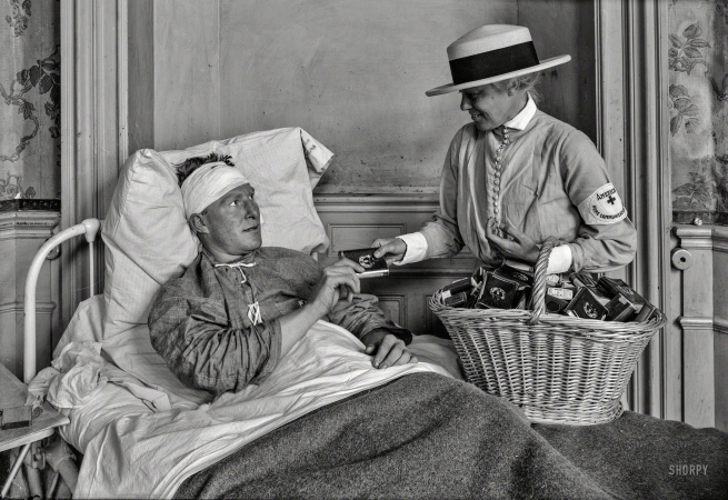 Photo showing: Nicotine Angel -- June 24, 1918. Red Cross distributing cigarettes in hospital at Contrexeville, France.