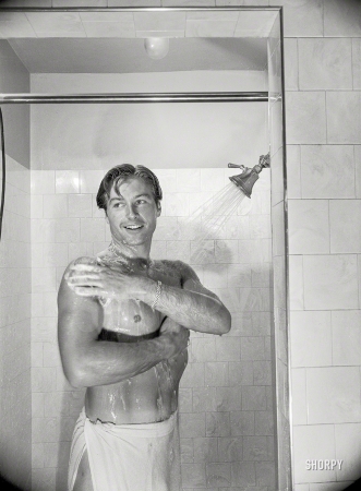 Photo showing: Shower Scene -- Los Angeles, 1948. Shower ends Lex's non-acting day that
includes lifting weights, punching bag and many other exercises. 