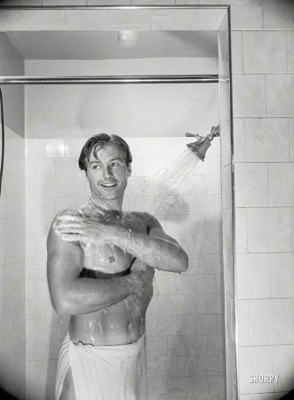 Photo showing: Shower Scene -- Los Angeles, 1948. Shower ends Lex's non-acting day that
includes lifting weights, punching bag and many other exercises. 