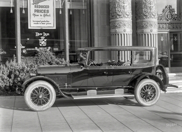 Photo showing: Reduced Prices -- San Francisco circa 1924. Done Lee Cadillac agency -- N.E. corner Van Ness & O'Farrell.