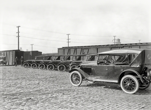 Photo showing: New Arrivals -- San Francisco circa 1920. Grant Six touring cars after unloading.