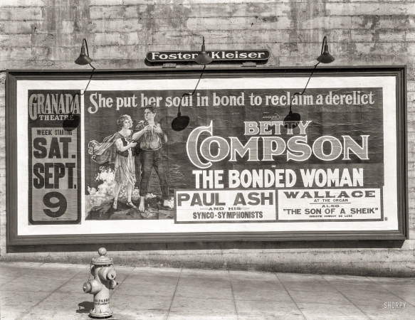 Photo showing: The Bonded Woman -- San Francisco, 1922. Foster & Kleiser billboard.