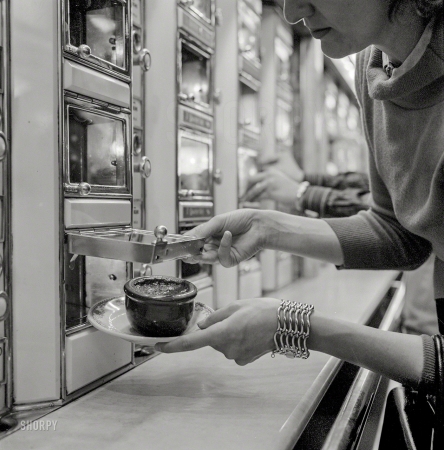 Photo showing: Hot Beans -- July 1955. Horn & Hardart, New York. Woman getting a dish of baked beans from an automat.