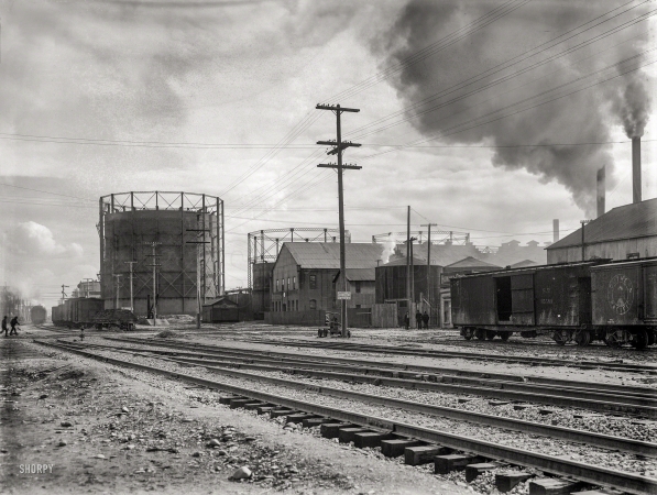 Photo showing: Industrial Landscape -- Circa 1910. Gasometers and rail yard at Oakland, California.